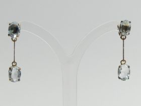 A pair of 9ct gold blue topaz drop earrings, 2.5 grams, 26mm long. UK Postage £12.