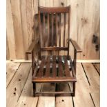 Edwardian stained beech folding steamer chair. 96cm high. Collection only.