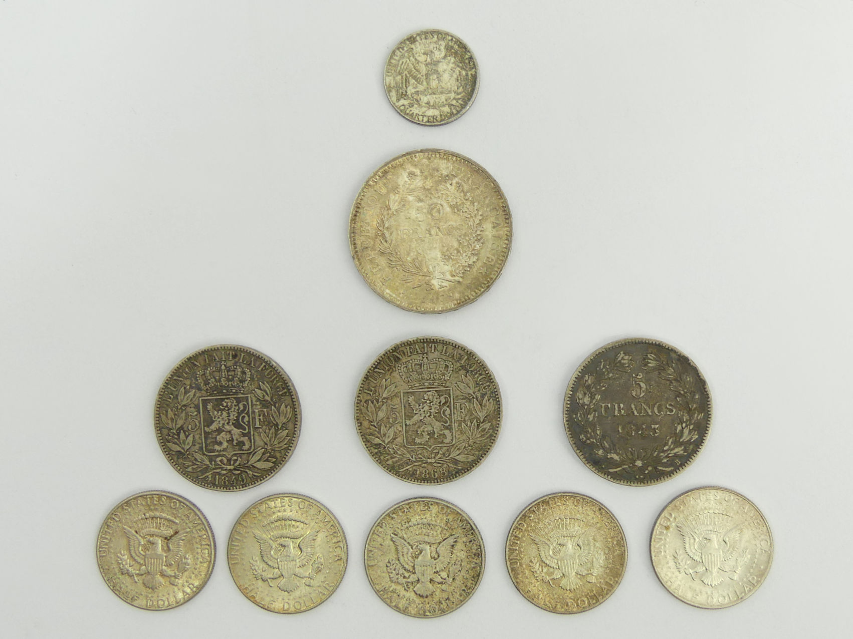 Various coins including 1868 and 1849 Leopold II 5 Francs.