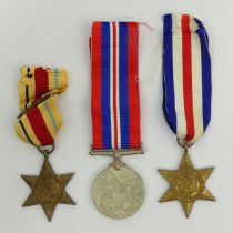 World War II medal trio - France and Germany Star, Africa Star and 1939 - 45 war medal. UK