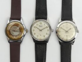 An Elgin manual wind watch, a Wyler example and a Lanco two tone dial gents watch, 35mm+ 36mm inc.