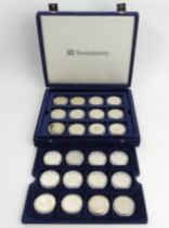 A presentation case of royal commemorative silver and other coins. UK Postage £14.