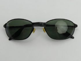 A pair of black framed Ray Ban sunglasses. UK Postage £12.