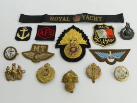 Various cloth badges including parachute regiment cap badges and a royal yacht cap band. UK