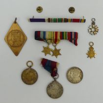 Various commemorative medals and World War II miniature stars. UK Postage £12.