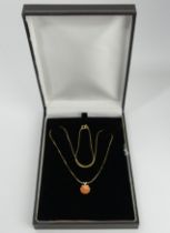 14ct gold coral pendant and chain, 2.4 grams. UK Postage £12.