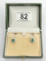 A pair of 18ct gold emerald and diamond earrings, 3.7 grams, 12mm x 10mm. UK Postage £12.
