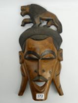 A large carved African wooden mask, 54cm. Collection Only.