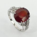 9ct white gold ruby and diamond ring, 3.8 grams, 11.8mm, size N 1/2. UK Postage £12.