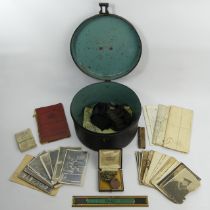 A World War I hat tin along with medals and related photographs of J.59866 HH Freer AB RN. UK