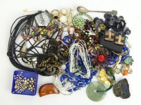A box of mixed costume jewellery including necklaces and brooches. UK Postage £12.
