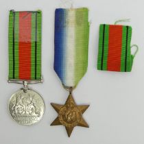 World War II defence medal and the Atlantic star. UK Postage £12.