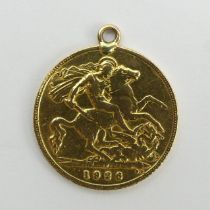 George V 1926 half sovereign with a 9ct mount, 4 grams. UK Postage £12.