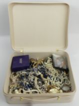 A box of costume jewellery including bead necklaces and silver pendants. UK Postage £12.