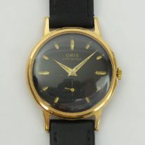 Oris gold tone black face, anti-shock movement gents watch on a leather strap, 34mm inc. crown. UK