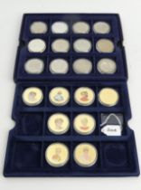 A presentation box of 25 royal commemorative and other coins including some silver examples. UK