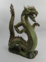 Chinese carved and painted wooden figure of a dragon, 44cm. UK Postage £20.
