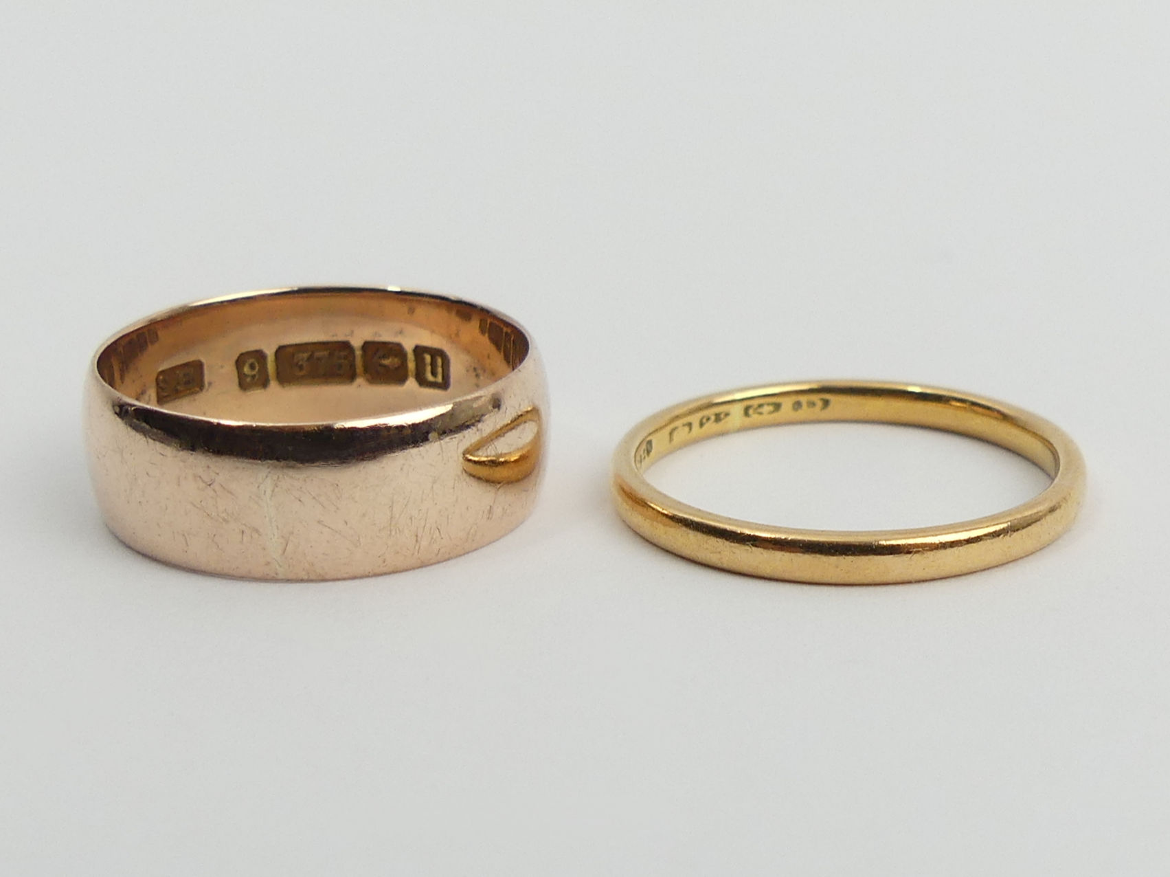 9ct rose gold wedding band, 2.8 grams and a 22ct gold example, 2 grams, both size L. UK Postage £12.