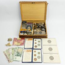 A box of mixed coinage and notes including George VI crowns and silver three pence pieces. UK