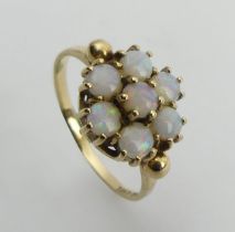 9ct gold opal seven stone ring, 2.2 grams, 10mm, size N1/2. UK Postage £12.