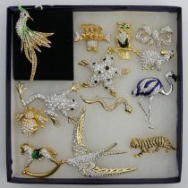 Thirteen crystal set gold and rhodium plated costume brooches. UK Postage £12.