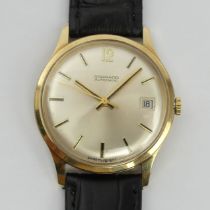 9ct gold Garrard gents automatic date adjust watch on a black leather strap, C.1975. UK Postage £12.