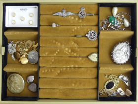 A jewellery box and contents including silver bracelets, lockets, lava cameo brooch, rings and