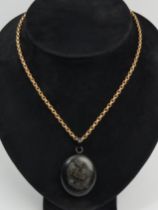 Victorian vulcanite and jet memorial locket and rolled gold chain, 22.7 grams, locket 49mm, chain
