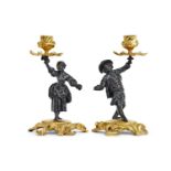 A PAIR OF ROCOCO REVIVAL GILT AND PATINATED BRONZE FIGURAL CANDLESTICKS CIRCA 1830