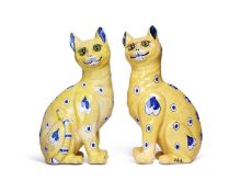 A PAIR OF GALLÉ YELLOW FAIENCE MODELS OF SEATED SMILING CATS, C. 1885