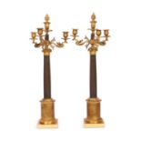 A PAIR OF EMPIRE PERIOD GILT AND PATINATED BRONZE CANDELABRA, EARLY 19TH CENTURY, FRENCH