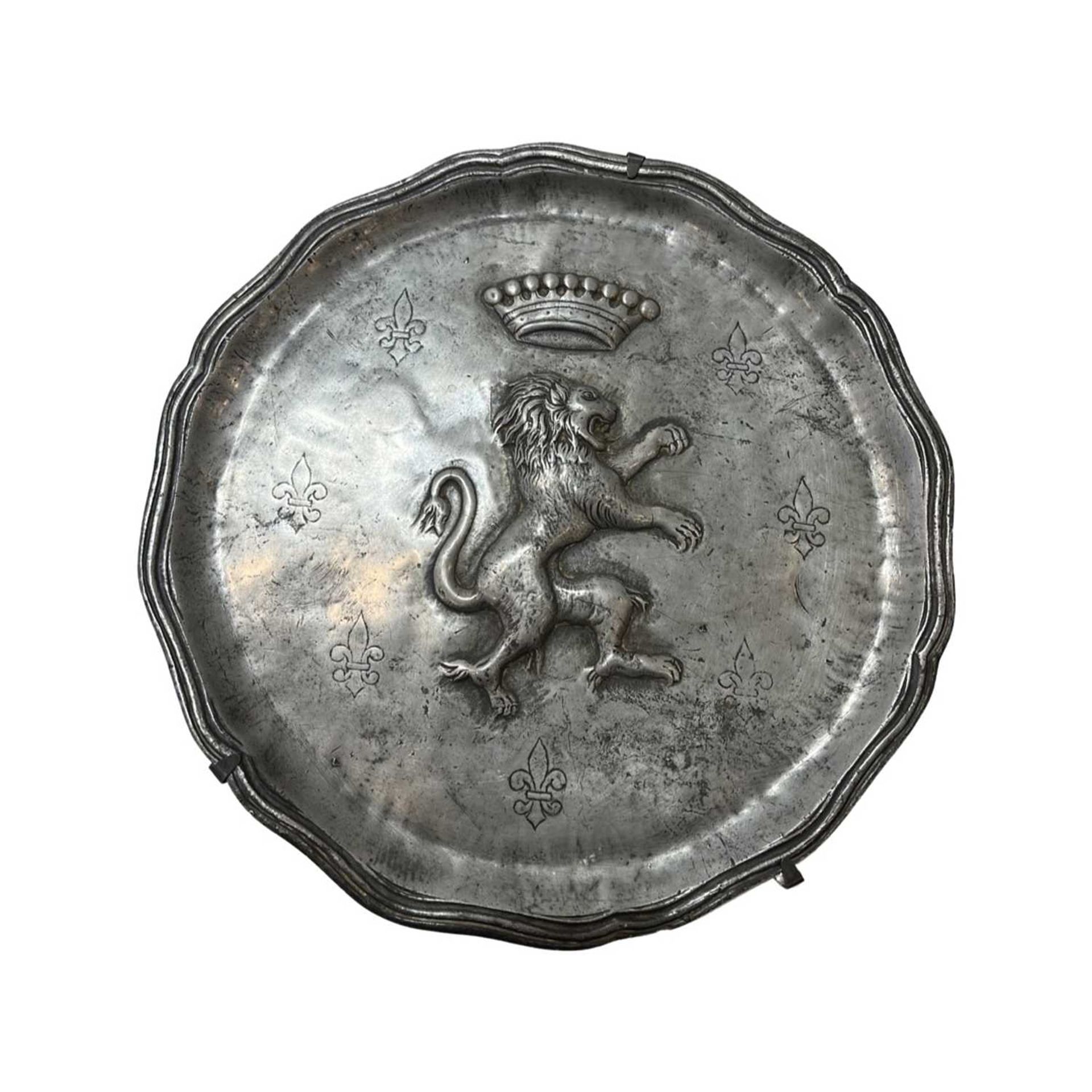 A 19TH CENTURY PEWTER DISH WITH LION RAMPANT