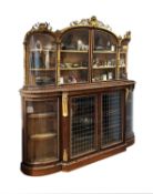 A MID 19TH CENTURY ROSEWOOD AND PARCEL GILT DISPLAY CABINET