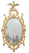 A GEORGE III CHIPPENDALE STYLE GILTWOOD MIRROR