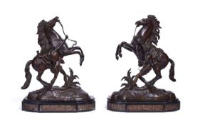 A PAIR OF 19TH CENTURY BRONZE MODELS OF THE MARLEY HORSES AFTER COUSTOU (FRENCH, 1677-1746)