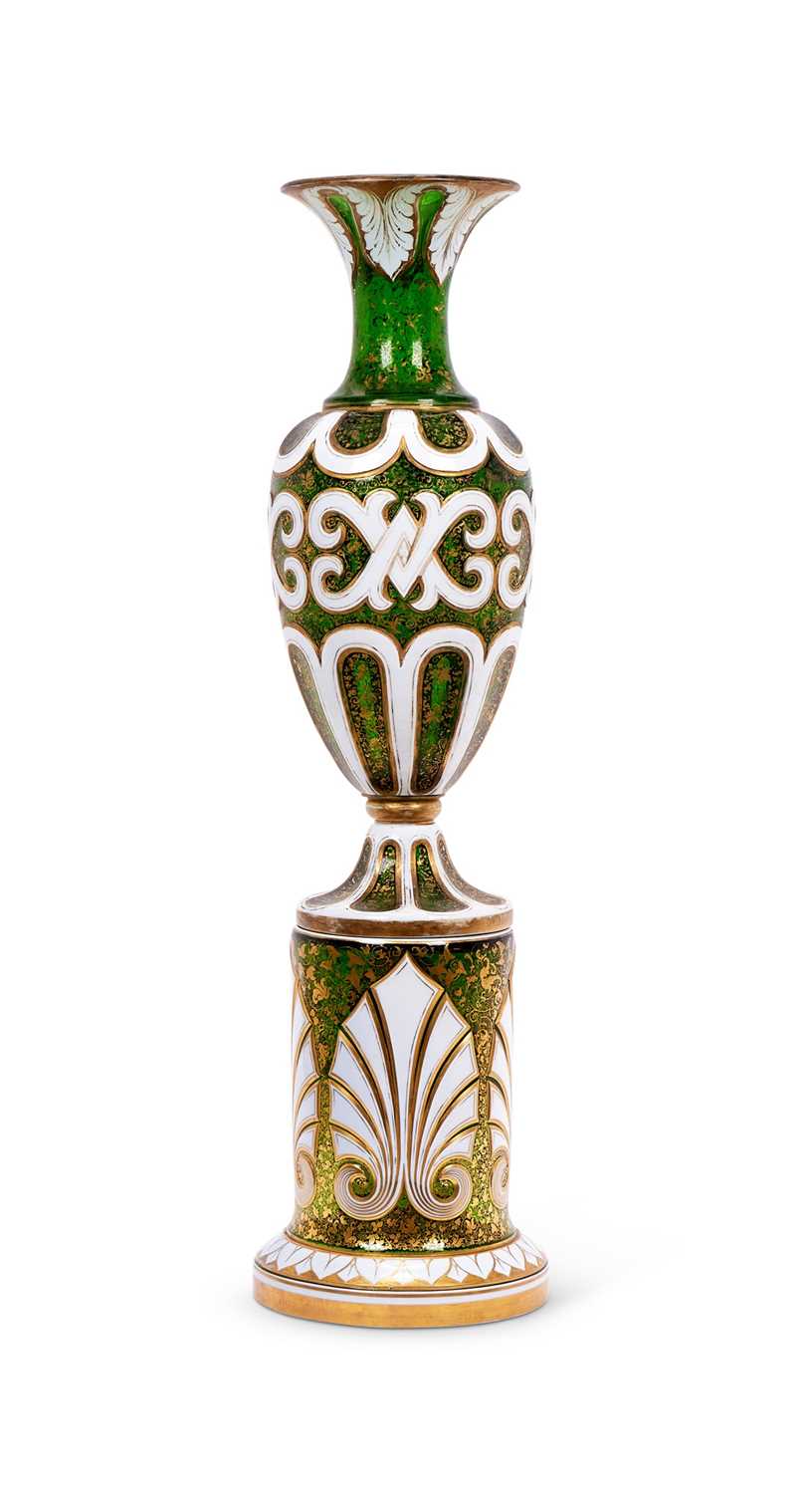 A LARGE 19TH CENTURY BOHEMIAN WHITE OVERLAY GREEN GLASS VASE ON STAND