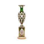 A LARGE 19TH CENTURY BOHEMIAN WHITE OVERLAY GREEN GLASS VASE ON STAND