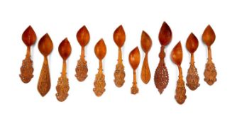 A COLLECTION OF TWELVE 19TH CENTURY PERSIAN CARVED WOOD SPOONS