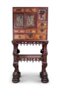 A FINE MEIJI PERIOD JAPANESE PADOUK CABINET ON STAND, TOKYO SCHOOL