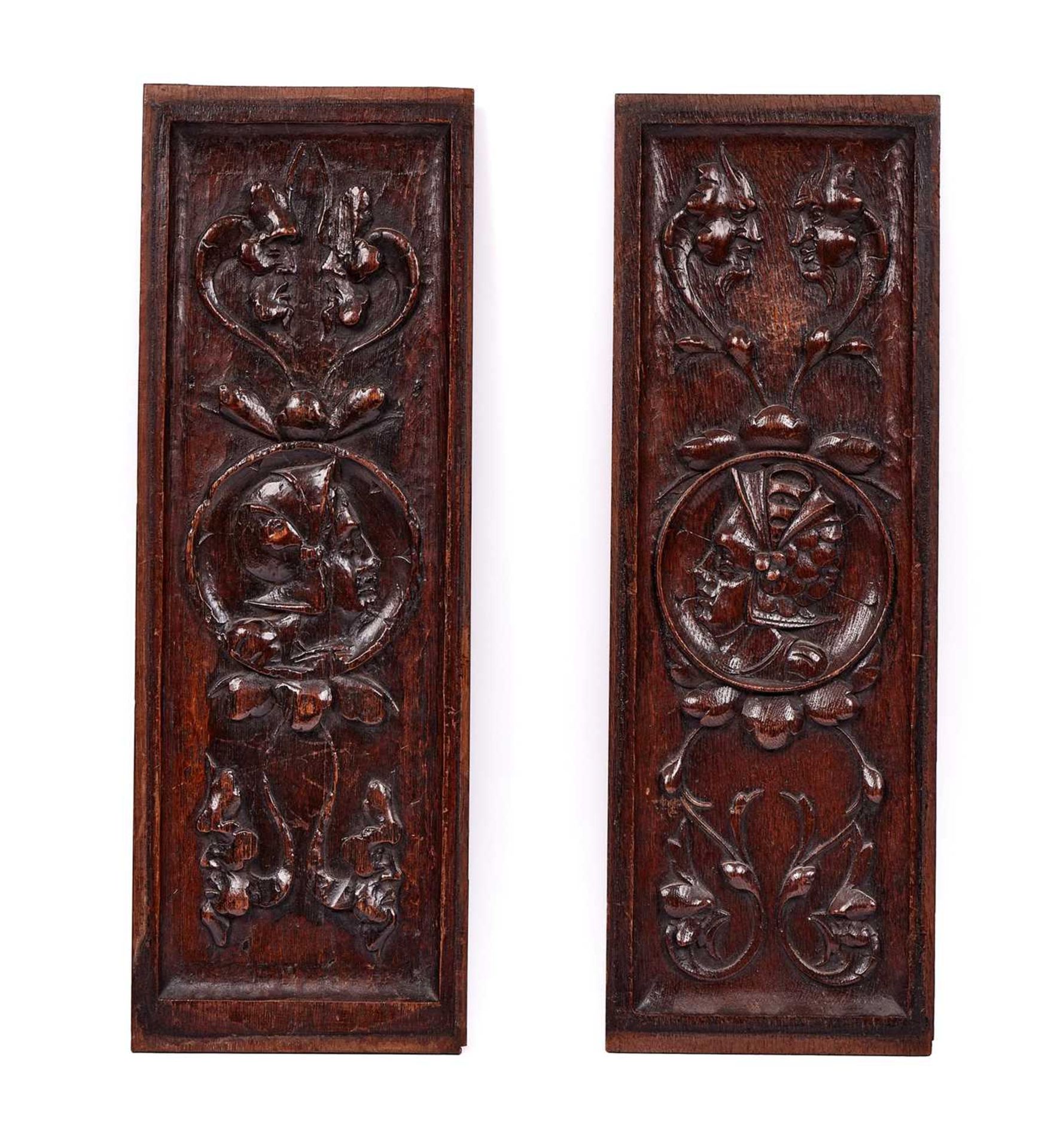 A PAIR OF 19TH CENTURY ROMAINE STYLE CARVED OAK PANELS
