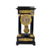 AN EARLY 19TH CENTURY FRENCH EMPIRE PERIOD EBOISED PORTICO CLOCK BY ROBERT, PARIS