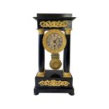AN EARLY 19TH CENTURY FRENCH EMPIRE PERIOD EBOISED PORTICO CLOCK BY ROBERT, PARIS