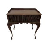 AN EARLY 20TH CENTURY QUEEN ANNE STYLE MAHOGANY TAMBOUR DESK