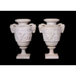 A PAIR OF 19TH CENTURY LOUIS XVI STYLE STATUARY MARBLE URNS AFTER THE MODEL BY CLODION