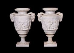 A PAIR OF 19TH CENTURY LOUIS XVI STYLE STATUARY MARBLE URNS AFTER THE MODEL BY CLODION