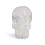 A SOLID CARVED ROCK CRYSTAL MODEL OF A HUMAN SKULL