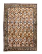 A FINE AND LARGE PART SILK QUM CARPET