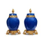 A PAIR OF LATE 19TH / EARLY 20TH CENTURY CHINESE PORCELAIN AND GILT BRONZE MOUNTED VASES