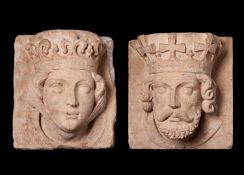 A PAIR OF 19TH CENTURY CARVED STONE HEADS OF A KING AND QUEEN