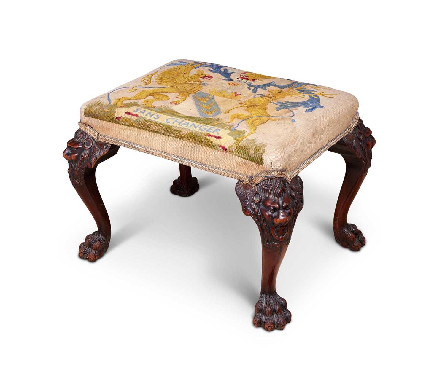 A 19TH CENTURY IRISH MAHOGANY FOOTSTOOL WITH THE ARMS OF THE EARLY OF DERBY